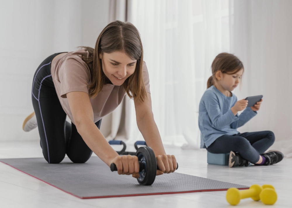 Postnatal woman training at home with kid