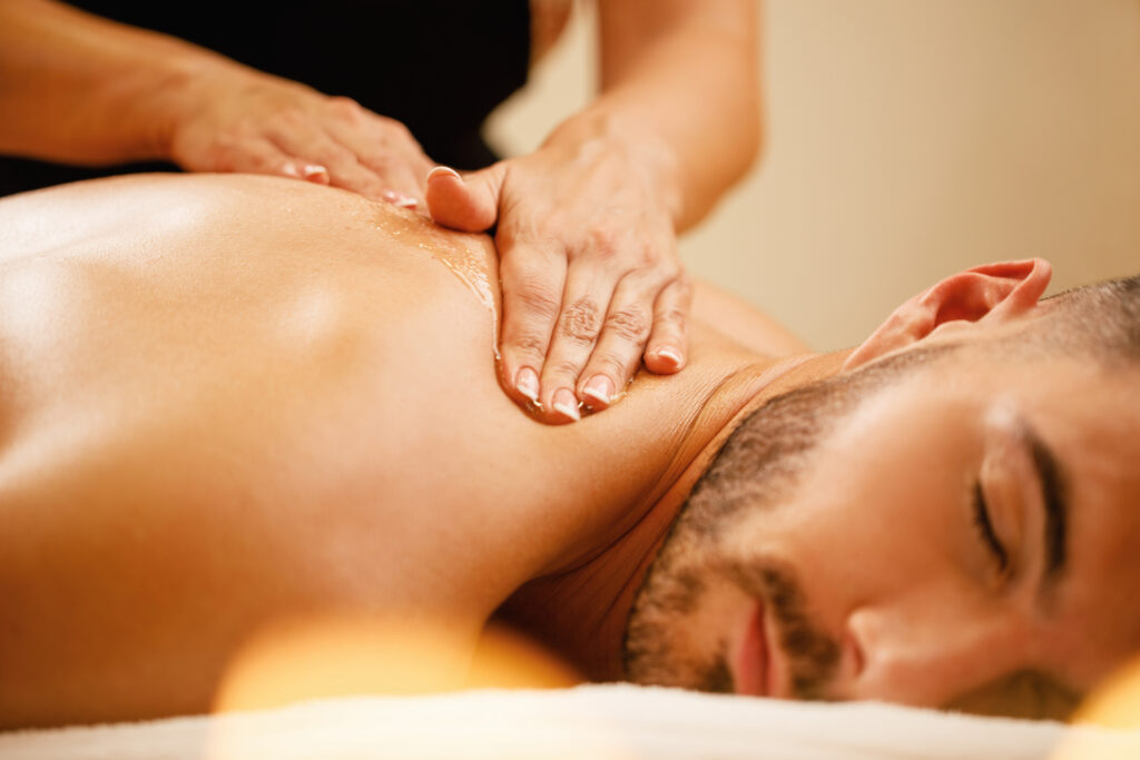 Man relaxing during a spa massage to reduce stress and naturally increase testosterone levels.