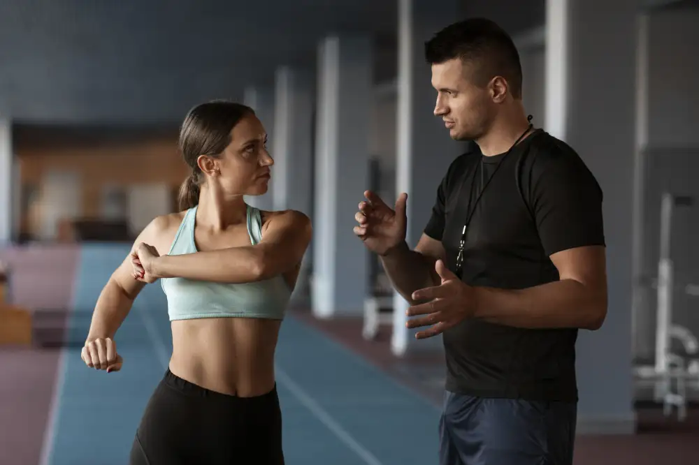 Personal Trainer in Dubai correcting client's technique