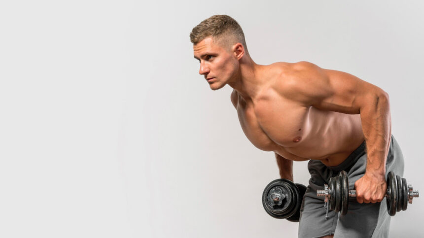 A fitness athlete doing dumbbell tricep kickback exercise