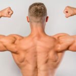 Athlete showing his back muscles after doing close grip lats pulldown exercise