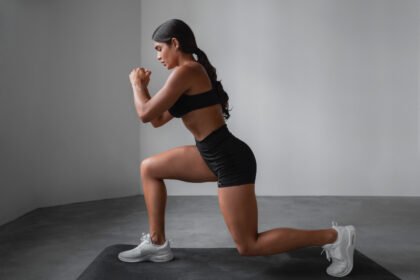 Fit girl doing front lunges exercise