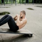 Athlete doing Abdominal crunches on a decline bench