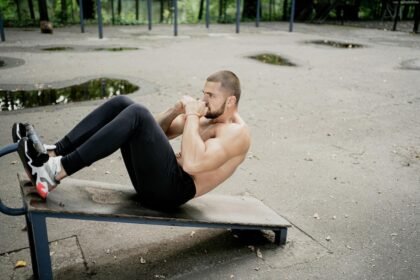 Athlete doing Abdominal crunches on a decline bench