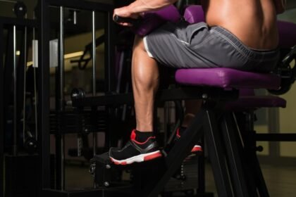 Bodybuilder doing a seated calves exercise