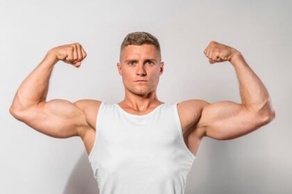 An athlete showing bicep muscles after a workout
