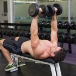 Dubai personal trainer demonstrating how to do dumbbell bench press