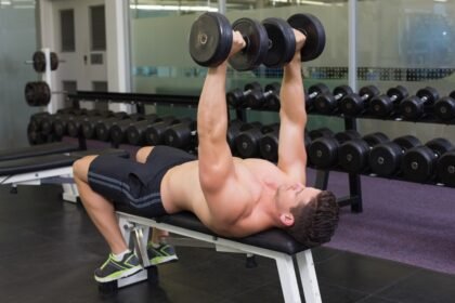 Dubai personal trainer demonstrating how to do dumbbell bench press