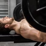 An athlete doing Reverse grip bench press exercise