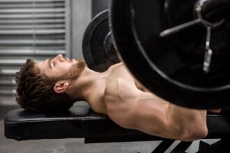An athlete doing Reverse grip bench press exercise