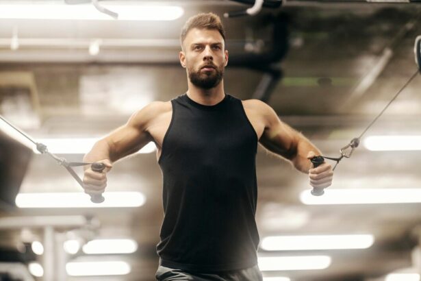 Fitness Athlete doing Chest Flys on a cable machine in Dubai Gym