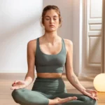 A young woman doing chakra yoga