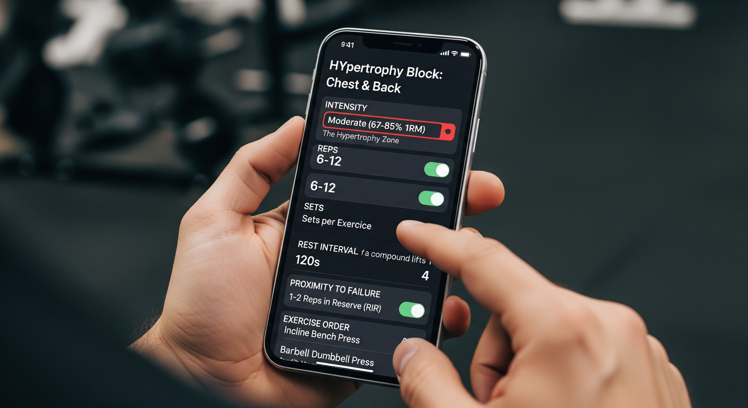 A close-up of a person's hands programming a hypertrophy workout on a smartphone in a gym. The fitness app screen shows selected parameters: Moderate Intensity (67-85% 1RM), 6-12 reps, 4 sets, 120-second rest, and 1-2 Reps in Reserve, demonstrating scientific workout design.